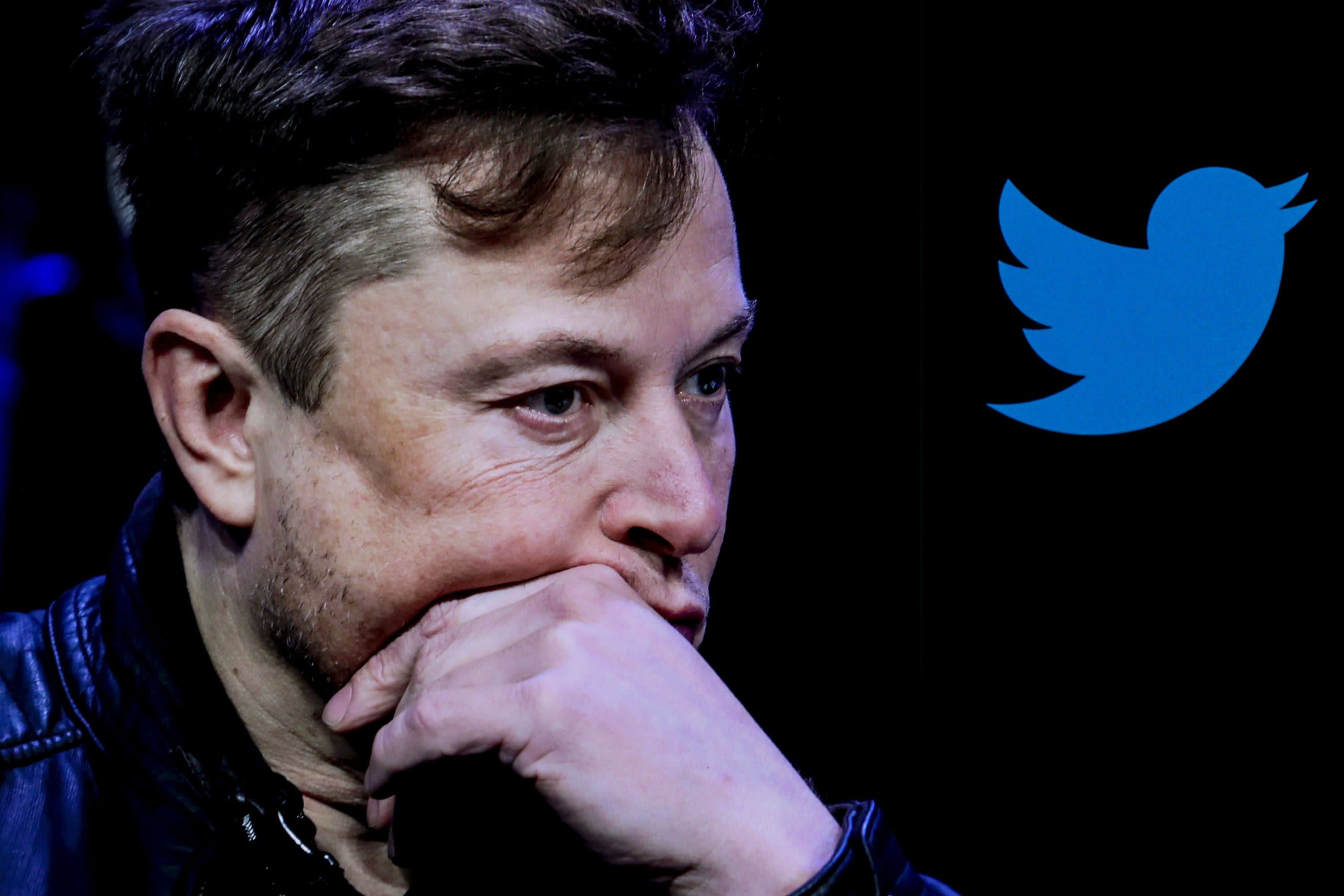 In this photo illustration, the image of Elon Musk is displayed on a computer screen and the logo of twitter on a mobile phone in Ankara, Turkiye on October 06, 2022.